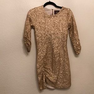 Gold sequined 3/4 ruched sleeve & left thigh
